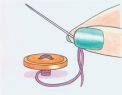 How to sew a two-hole button How to sew a two-hole button